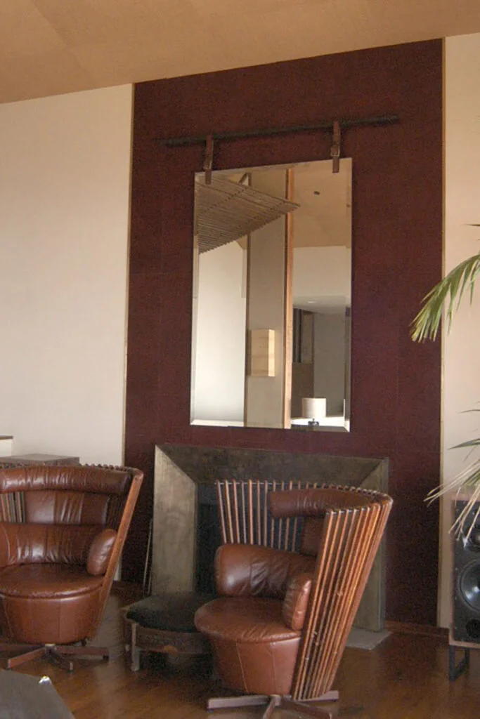 A strong and protruding fireplace separates it from the foundation of the wall.