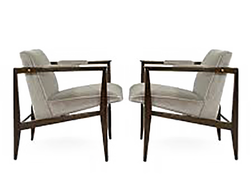 Edward Wormley designed these chairs with modern lines.  The chairs are gray and angled backward with squared off arms of dark wood.