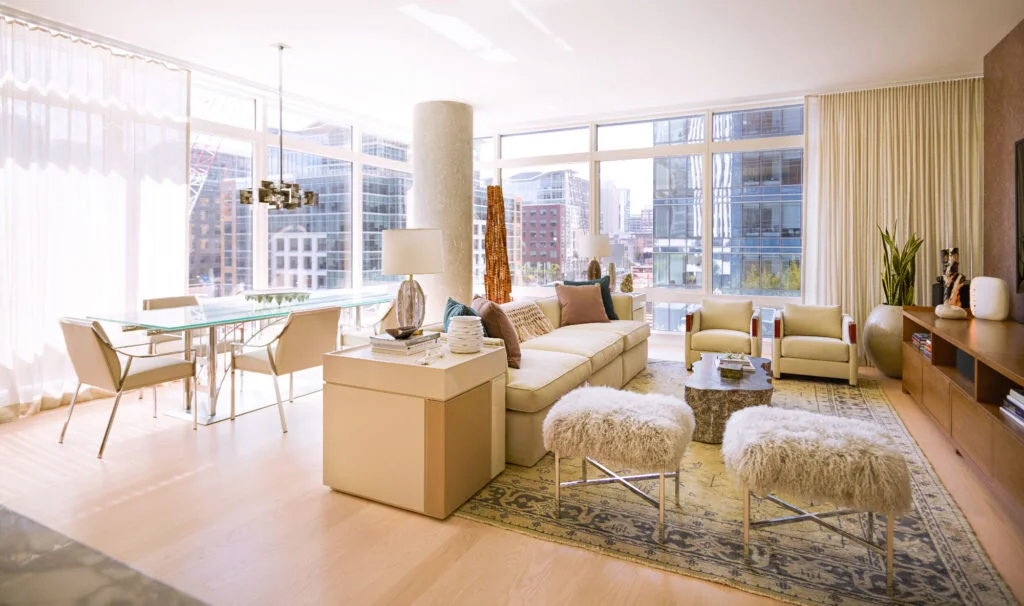 A San Francisco condominium designed in a modern style with a custom dining room table and sheer window treatments.