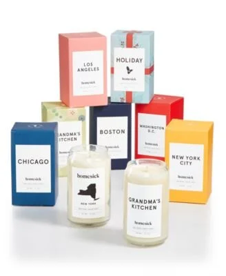 An assortment of colored boxes and candles from Homesick Candles.