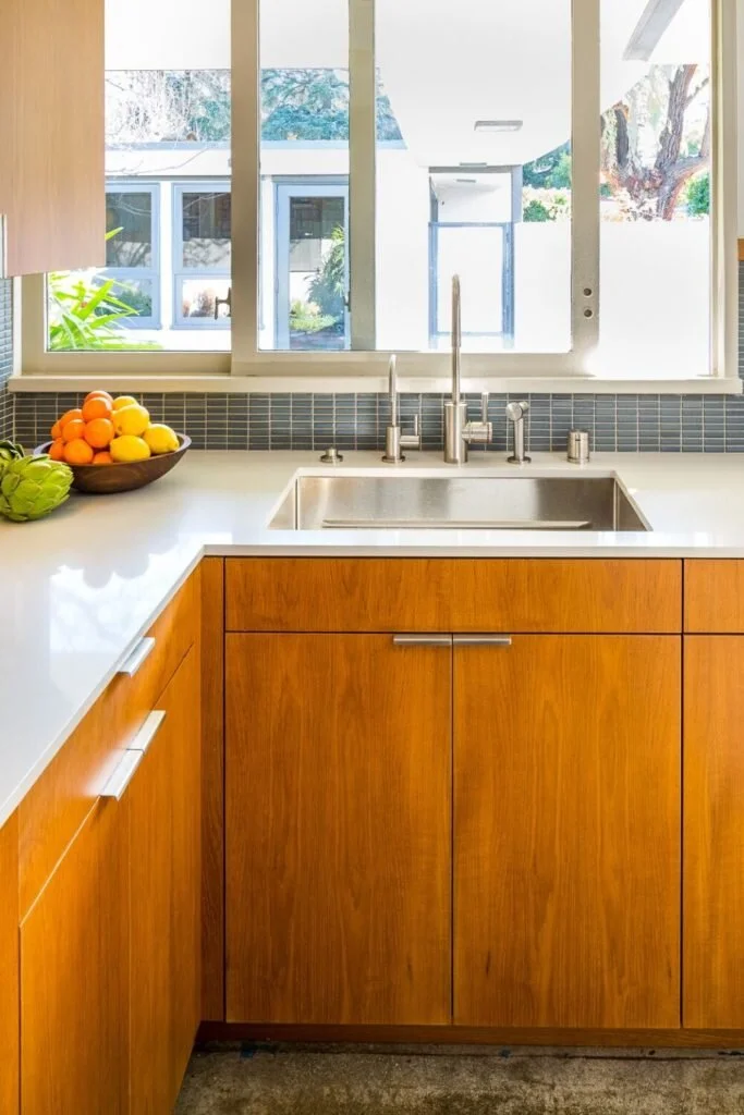 Teak was a very popular wood in the middle of the century. Mark Cutler Design used teak in this kitchen remodel.