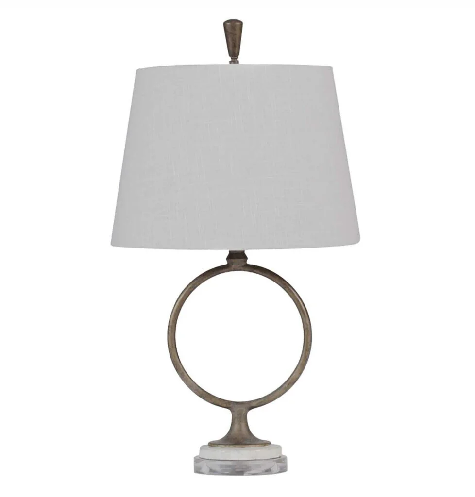 An organic keyhole lamp with a white shade.