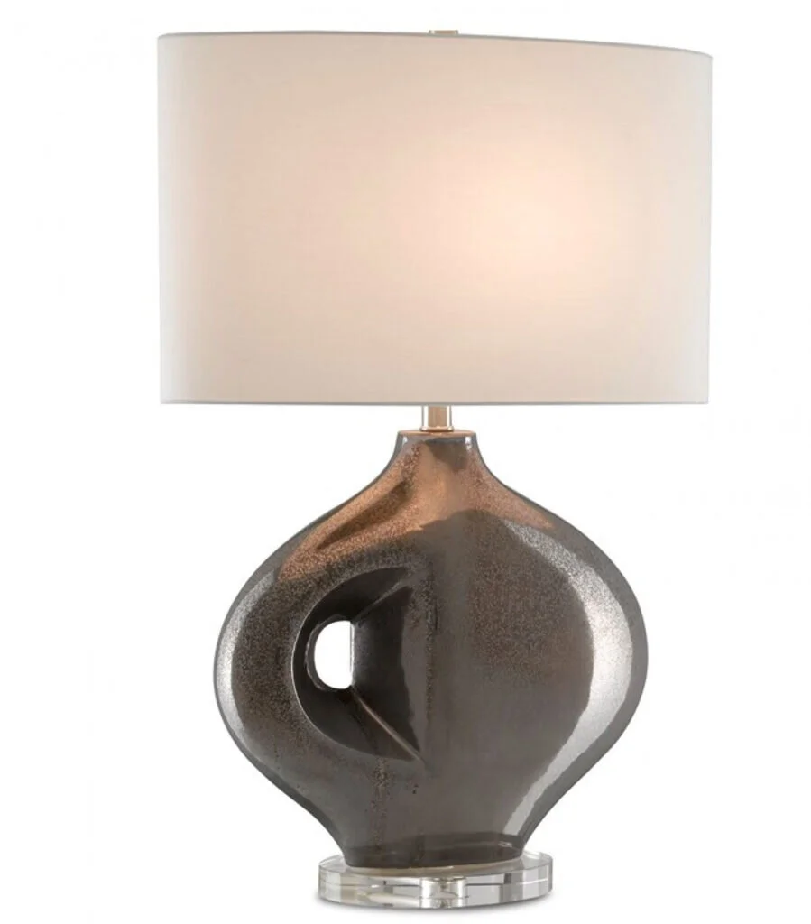 A gray sculptural metallic lamp with a keyhole.