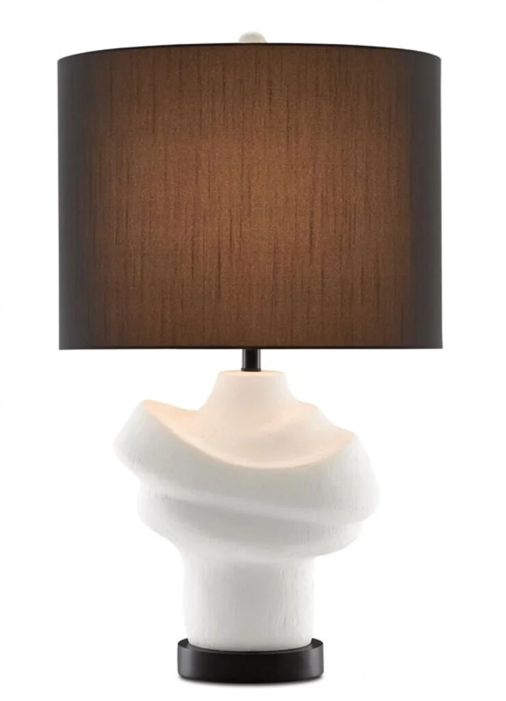 A sculptural lamp in cream with a deep chocolate brown lamp shade.